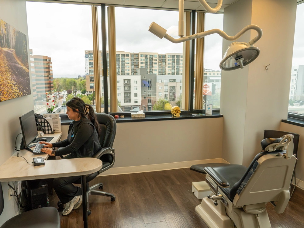 Team members engaging with patients in treatment room